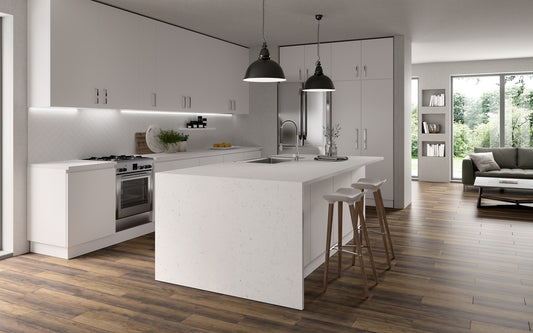 Modern kitchen with white island and wooden flooring