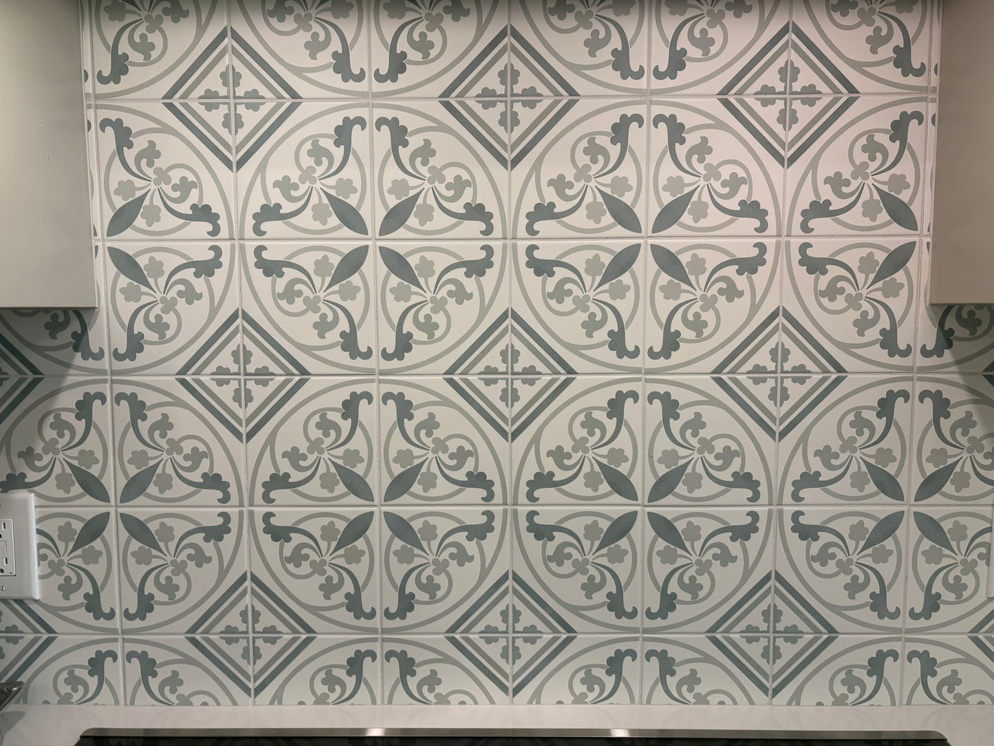 Decorative tiles with geometric patterns on a wall