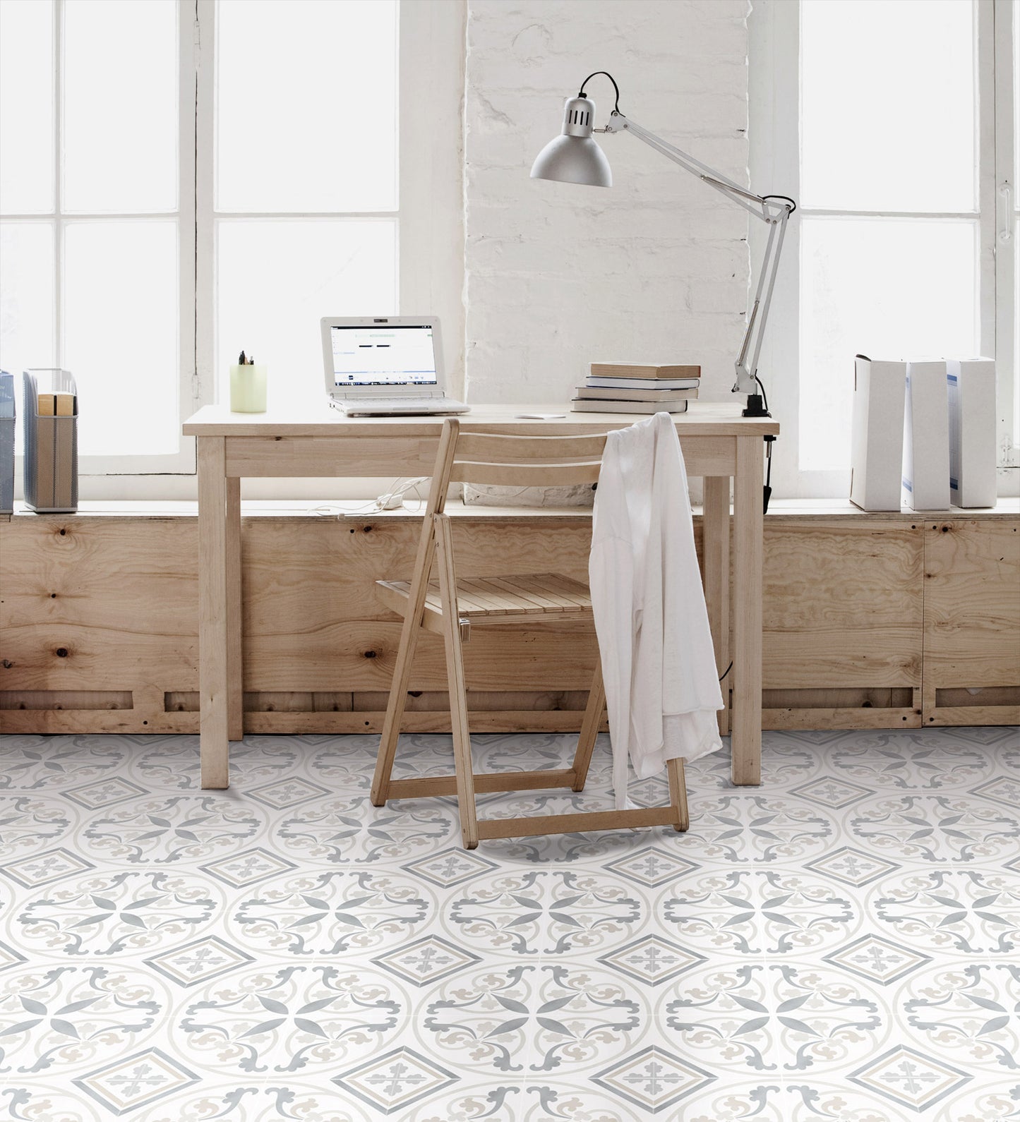 Modern home office with wooden desk, chair, and decor.