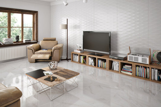 Modern living room with a TV, books, and decor on a white tiled floor.