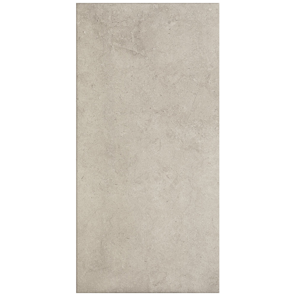 Rectangular tile with a beige color and textured surface on a white background