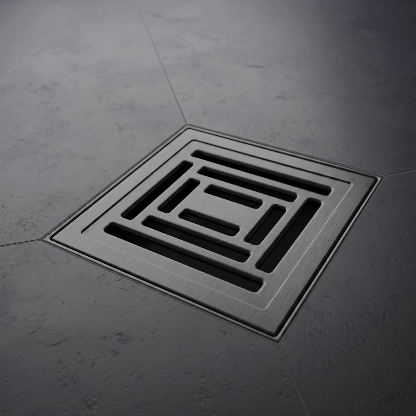 Square floor drain cover on a gray concrete floor