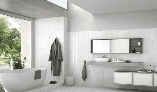 Modern bathroom with a freestanding bathtub, vanity, and large mirror.