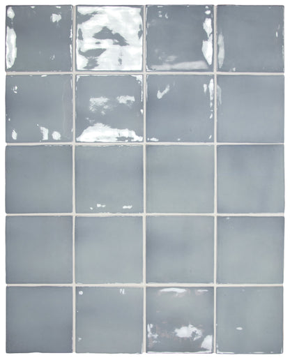 Grid of gray tiles with some chipped paint