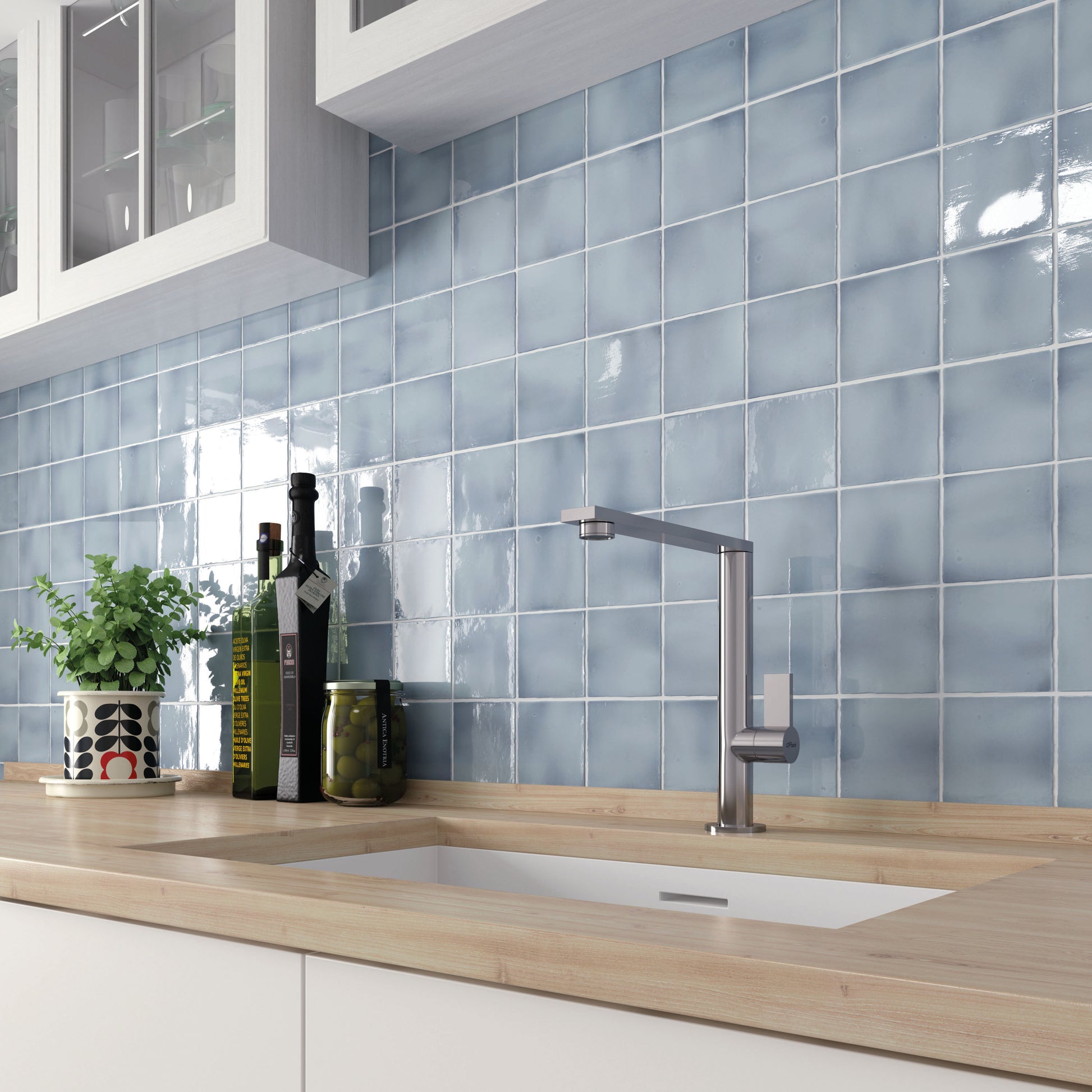 Modern kitchen with blue tiled backsplash and wooden countertop
