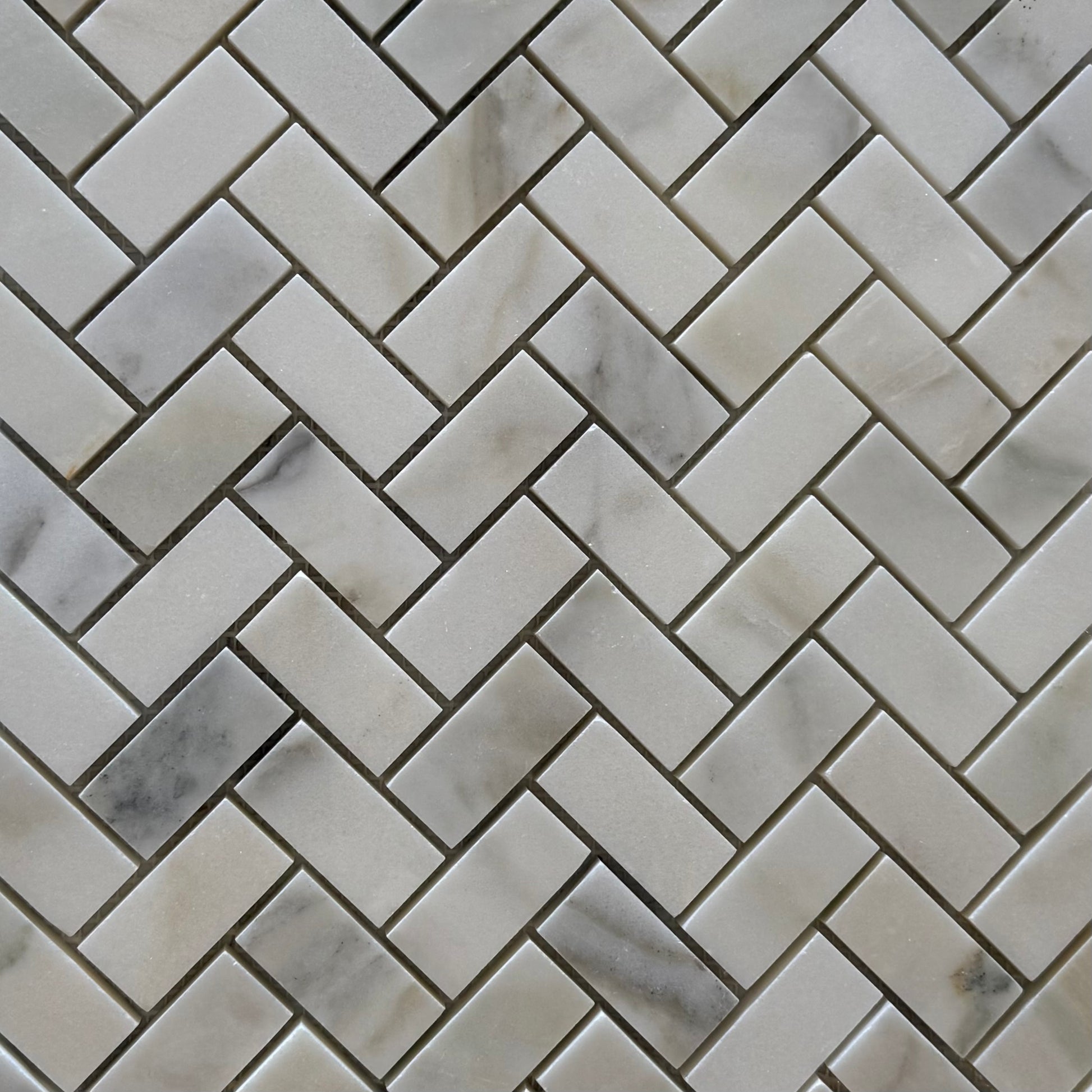 Marble mosaic tile with herringbone pattern