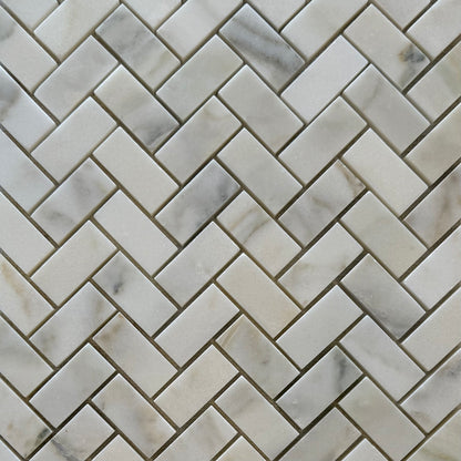 Marble tiles arranged in a herringbone pattern