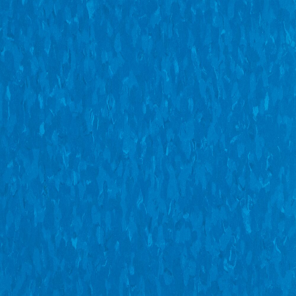 Solid blue color vinyl composition tile with a textured look