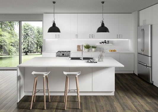 Modern kitchen with white island, stools, and stainless steel appliances.