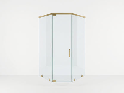 A corner shower enclosure with clear glass panels and brushed brass hardware, shown on a clean white studio background.
