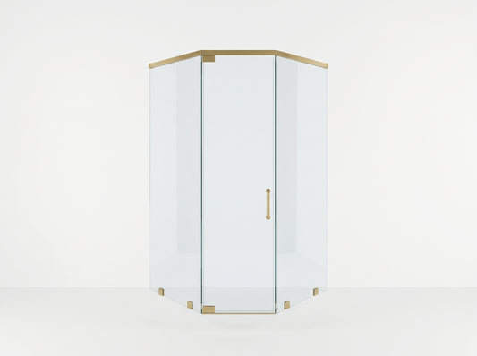 A corner shower enclosure with clear glass panels and brushed brass hardware, shown on a clean white studio background.