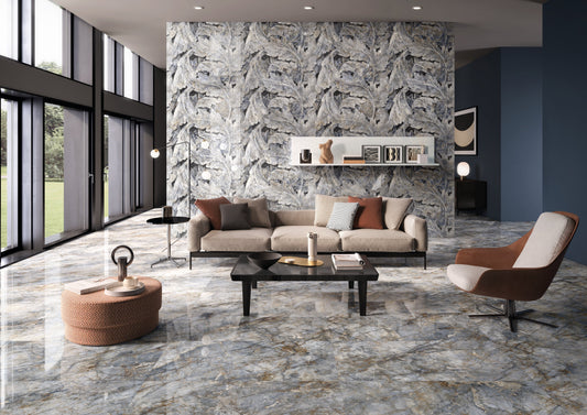 Modern living room with marble walls and floor, featuring a sofa and armchair.