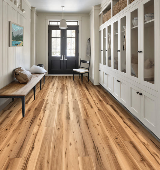 Hallway with wooden flooring, white walls, and a bench.