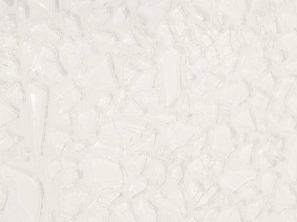 A close-up image of a white grout line, showing its texture and the fact that it is not solid white, but has some variation.