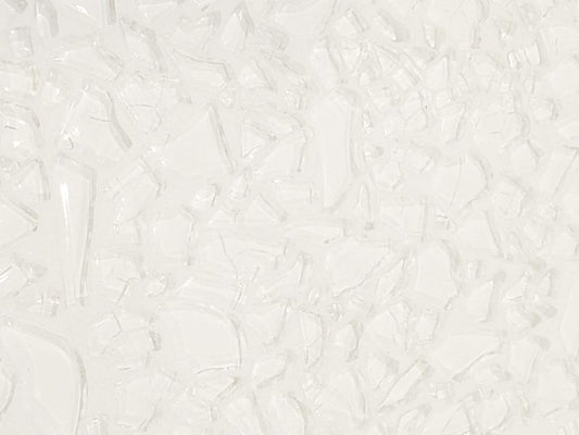 A close-up image of a white grout line, showing its texture and the fact that it is not solid white, but has some variation.