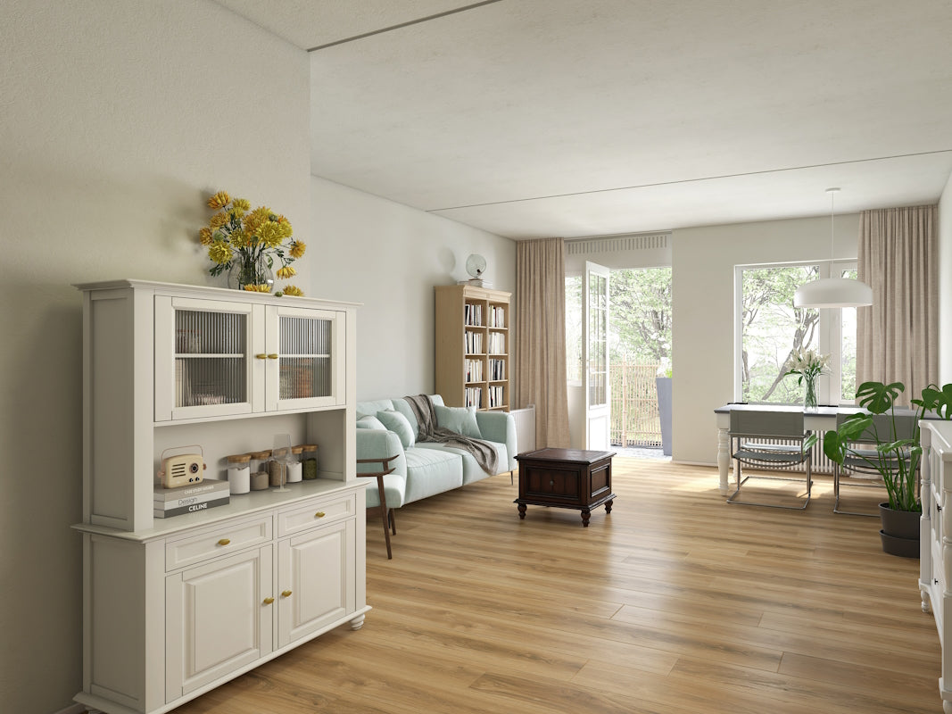 Modern living room with white furniture, bookshelf, and decor.
