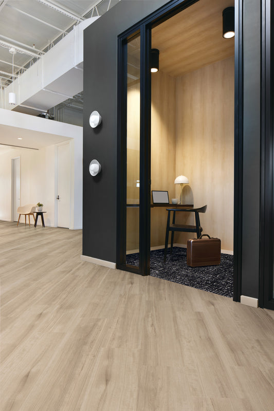 Interface Northern Grain LVT in Antique Wash installed ashlar in an office with Third Space 304 carpet tile