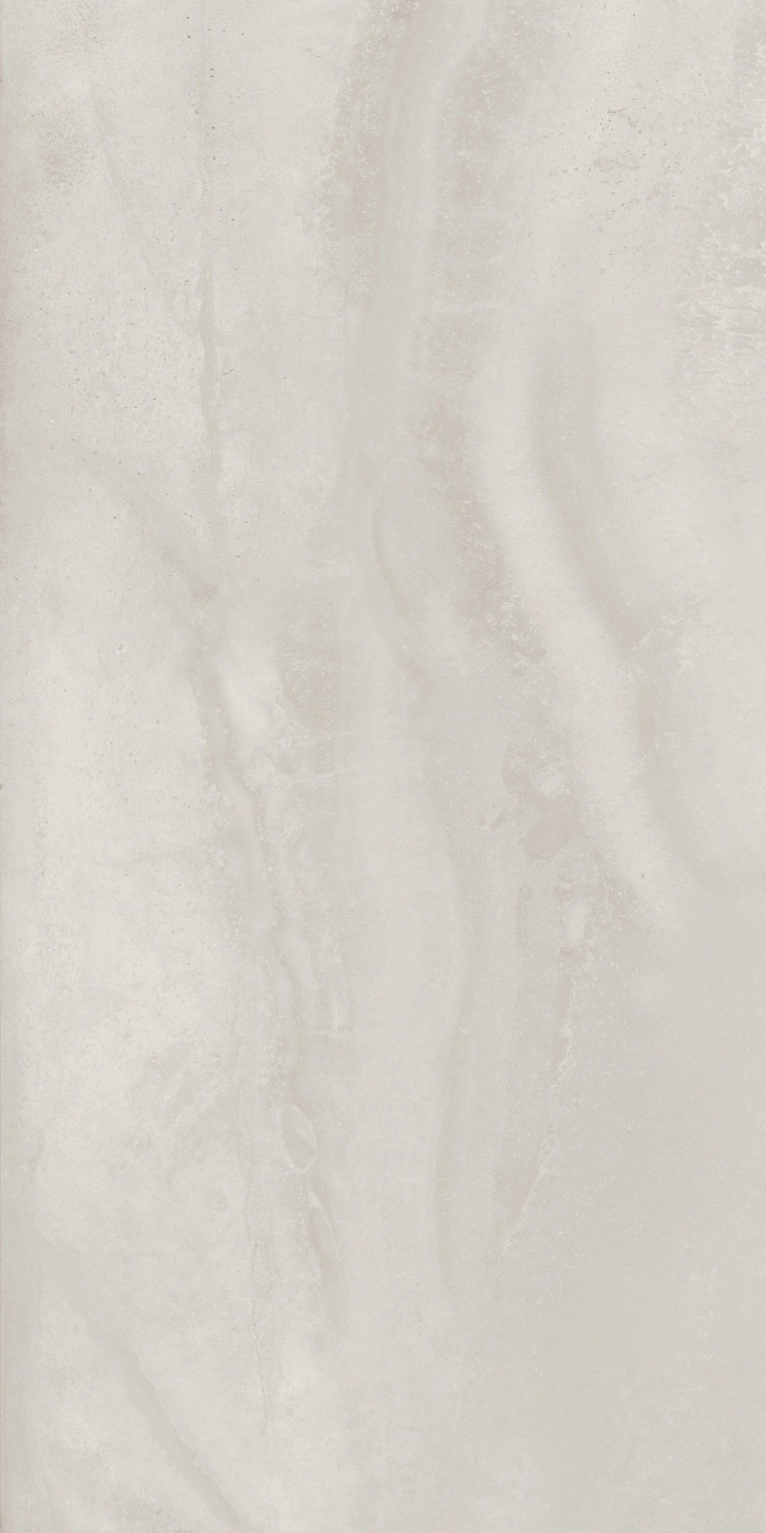 A close-up of a light warm off-white or cream marble-like surface with soft beige veining and a slightly glossy finish.
