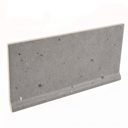 A rectangular gray concrete-look tile with embedded dark and light speckles, shown at an angle on a plain white background.