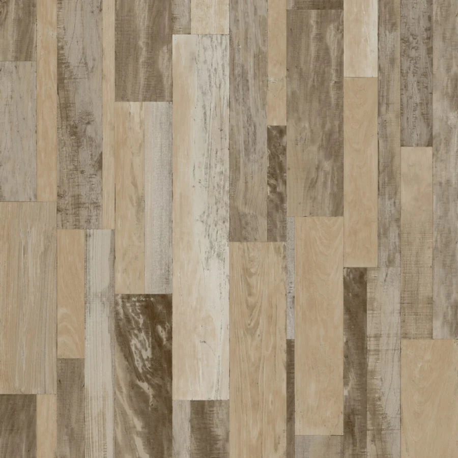 Wooden flooring with a patchwork pattern of various wood tones.