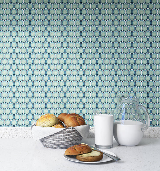 Hexagonal tile pattern on a wall with bread and milk in the foreground