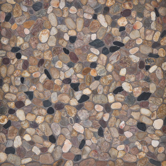 Pattern of small pebbles in various colors