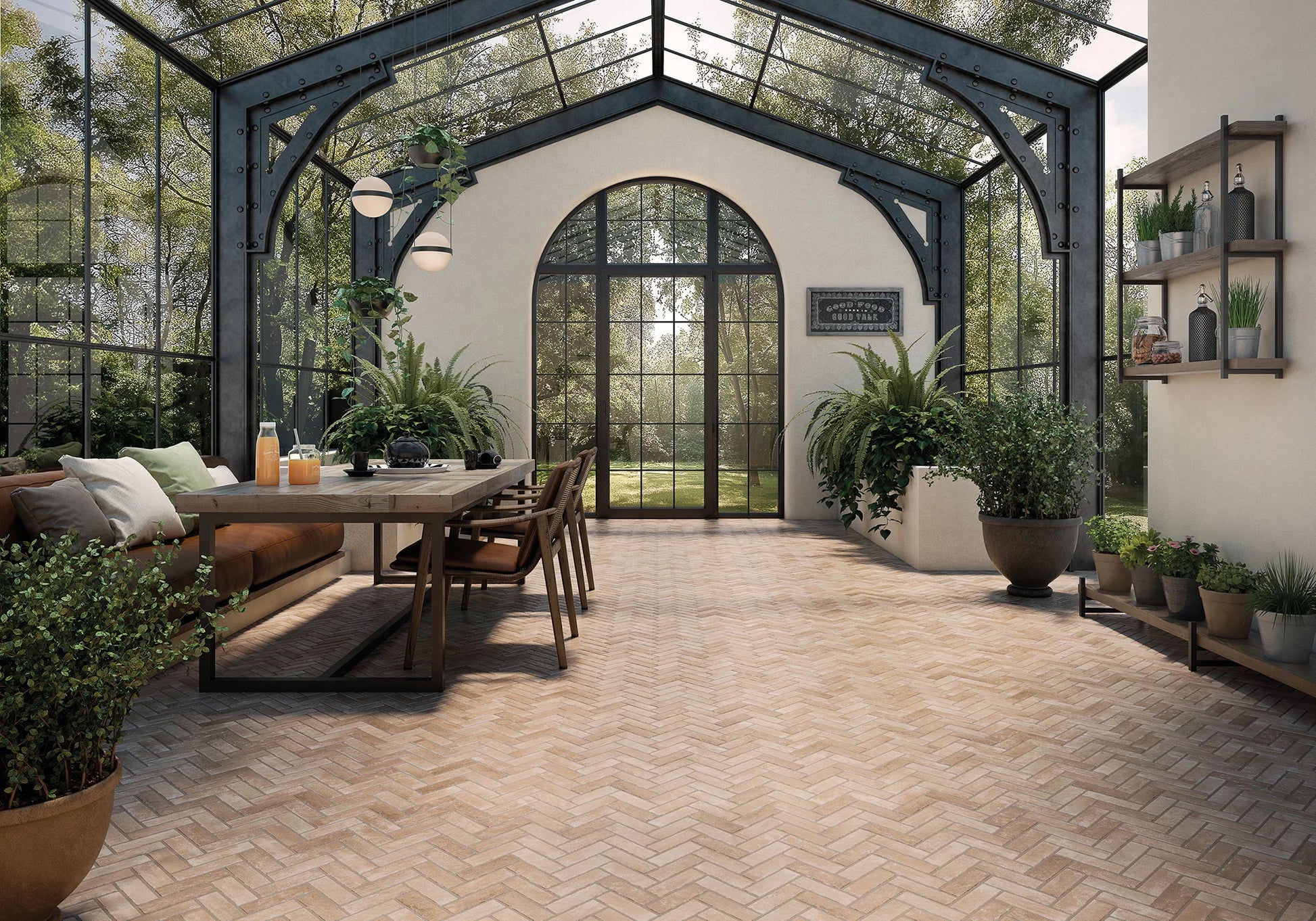Modern indoor-outdoor space with a dining table, chairs, and plants.