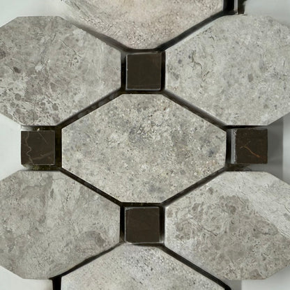 Hexagonal stone tiles with a geometric pattern on a white background