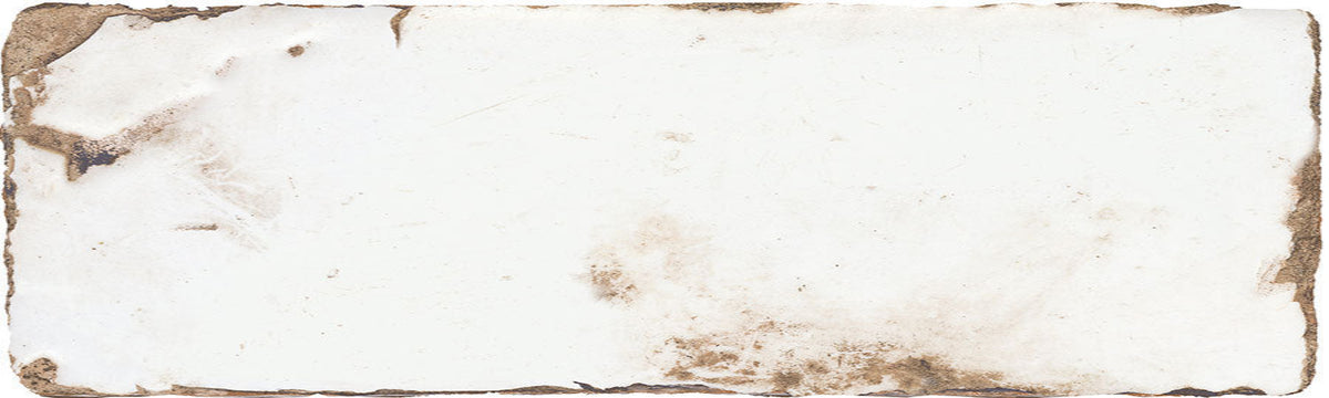A square ceramic tile with a distressed, vintage-style off-white surface, featuring brown stained or aged markings along the rough, uneven edges.