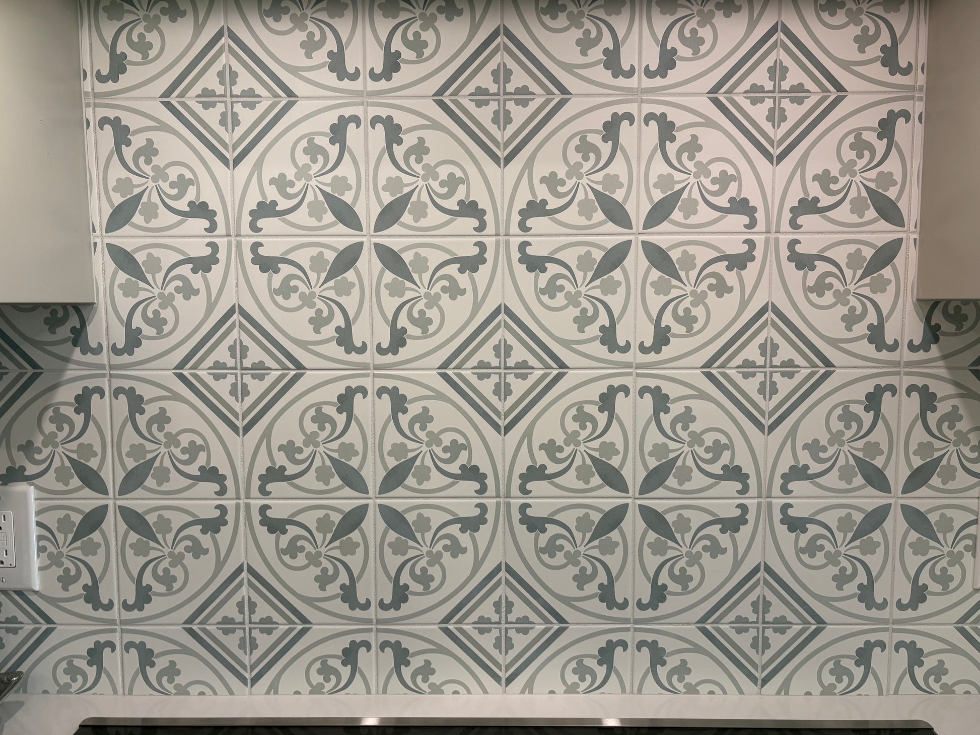 Decorative tiles with geometric patterns on a wall