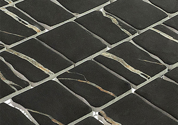 Close-up of black mosaic tiles with a grid pattern