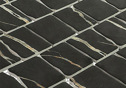 Close-up of black mosaic tiles with a grid pattern