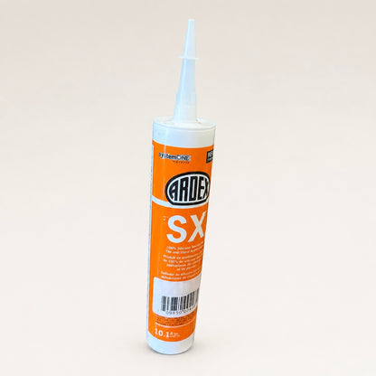 A tube of Ardex SX silicone sealant with an orange and white label, shown on a plain light beige background.