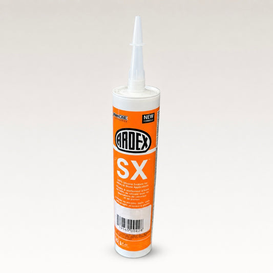 A tube of Ardex SX silicone sealant with an orange and white label, shown on a neutral light gray background.