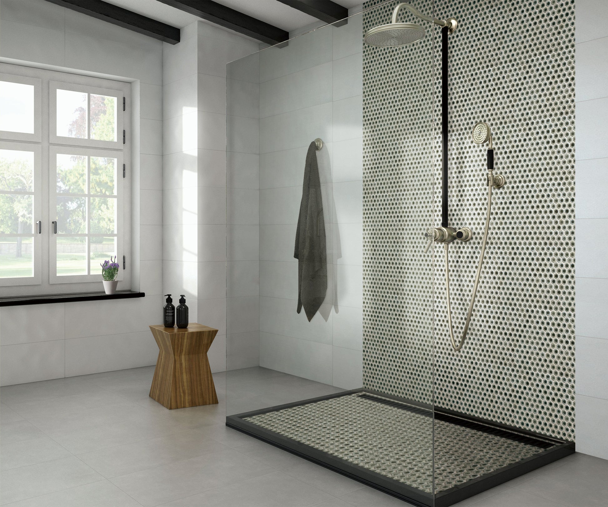 Modern bathroom with a shower area featuring a glass enclosure and tiled wall.