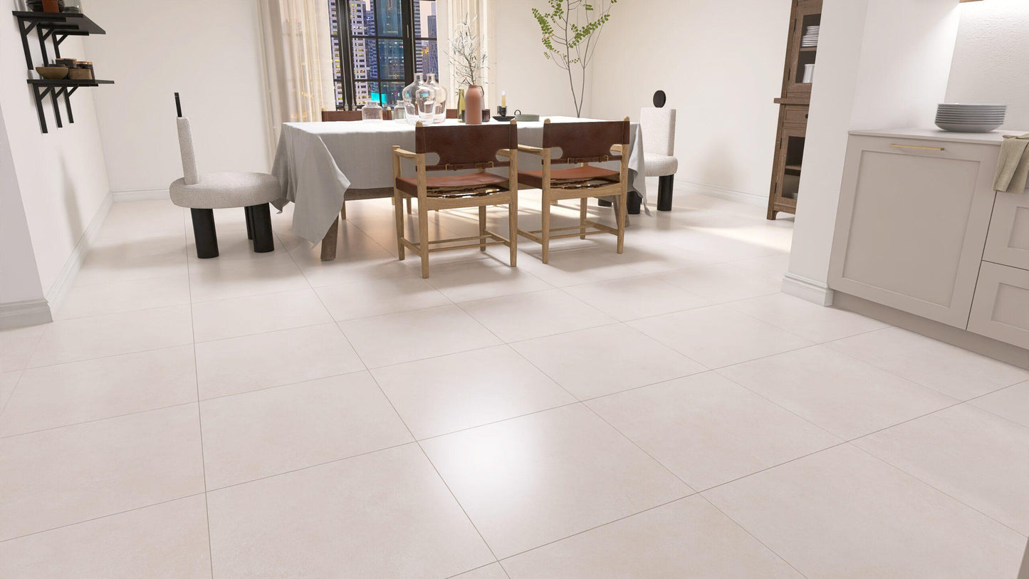 Large light beige square floor tiles in a modern, bright dining room setting.
