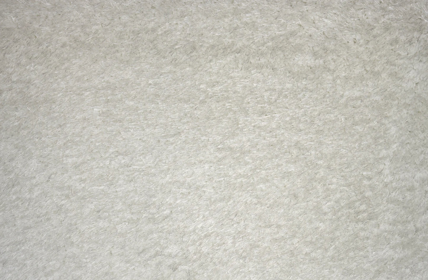 A close-up texture shot of a light gray felt or fleece fabric surface.