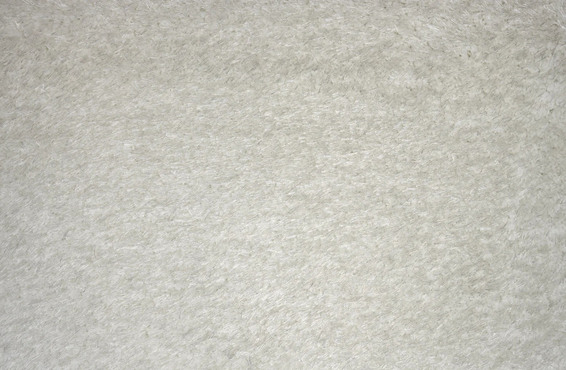 A close-up texture shot of a light gray felt or fleece fabric surface.