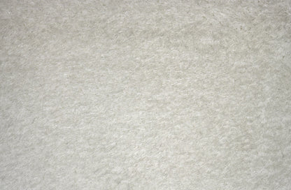A close-up texture shot of a light gray felt or fleece fabric surface.