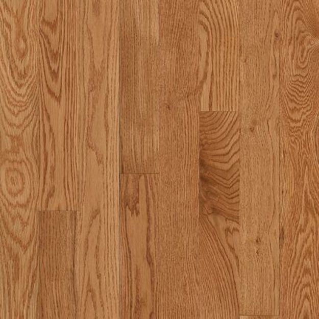 Oak wood flooring planks with a warm medium brown finish and visible natural grain patterns.