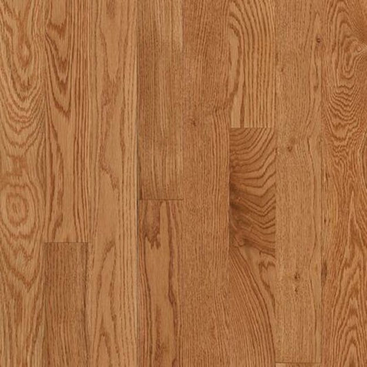 Oak wood flooring planks with a warm medium brown finish and visible natural grain patterns.