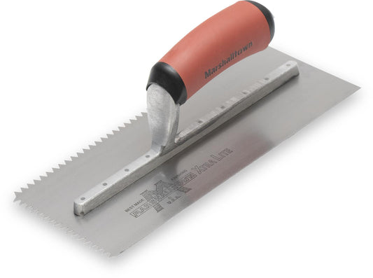 A V-Shaped Notched Trowel with an maroon handle and a silver blade, laying on a white surface.