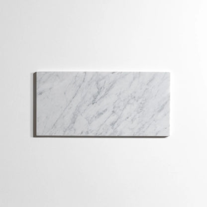 A rectangular white marble tile with elegant gray veining, displayed against a clean white background.