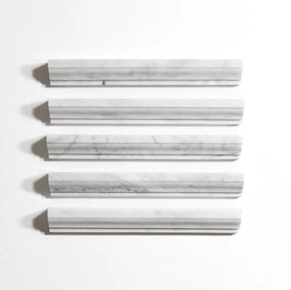 Four rectangular white marble-look wall tiles with gray veining, arranged horizontally on a clean white background.