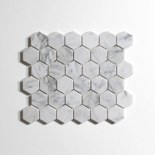Hexagonal white marble mosaic tile sheet with natural gray veining, displayed on a clean white background.