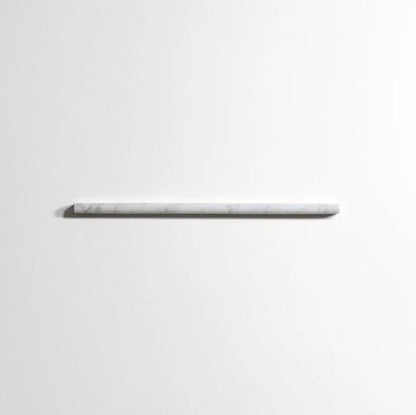 A minimalist white marble shelf with subtle gray veining, mounted horizontally against a clean white wall.