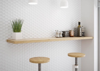 Wooden shelf with decorative items against a white tiled wall, accompanied by two stools.