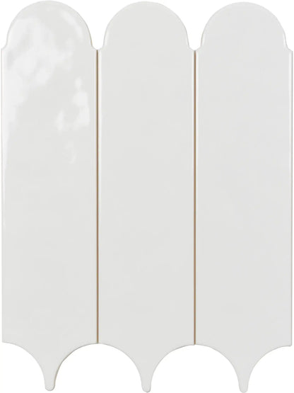 A glossy white ceramic tile with a decorative wavy scalloped border, shown from a top-down view.