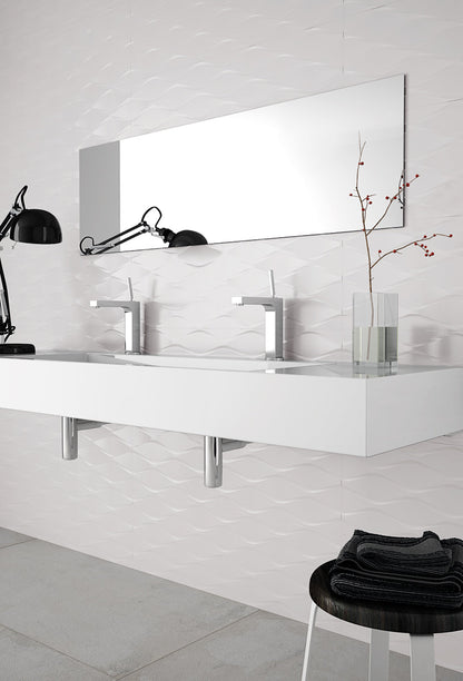 Modern bathroom with white vanity, mirror, and black stool.