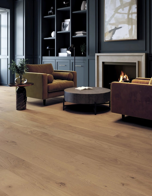 Modern living room with wooden flooring, brown sofa, and fireplace.
